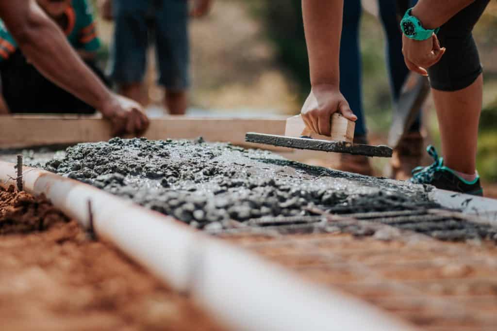 People applying concrete